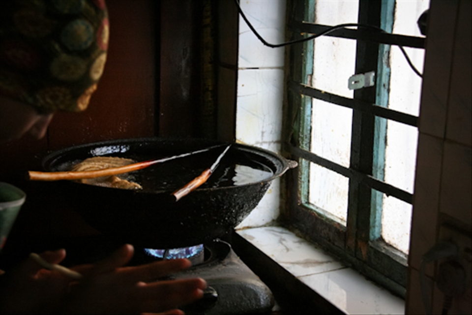 Food is especially special during the Uyghur festivals. This young girl is making Sangza; crispy, fried dough twists, which are one of the most important snacks for festivals as well as other special occasions such as weddings. 
Foreigners like to call this snack 