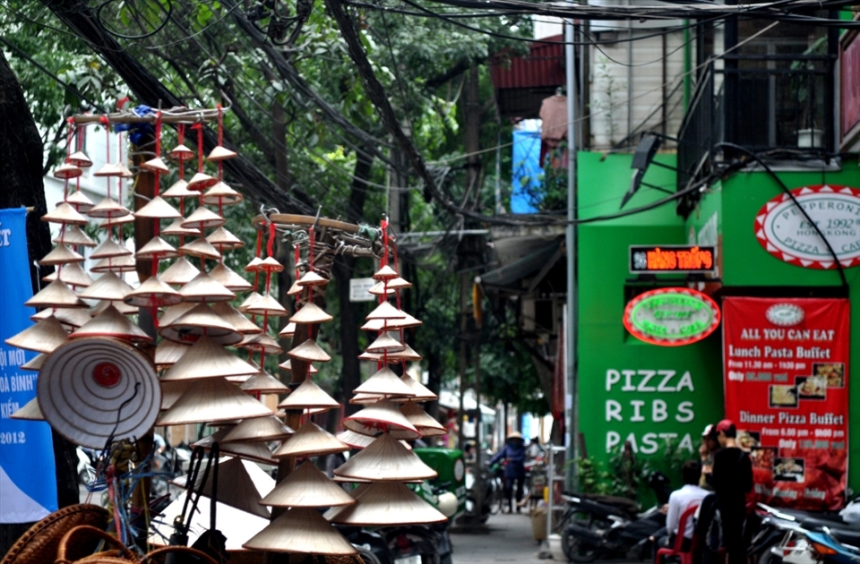 I was walking alone in the streets of Hanoi, searching for a cup of cold Vietnamese coffee since I had gotten addicted to it when I was in Ho Chi Minh. I didn't find the coffee, but I found the hats. They're not entirely connected of course, but to me they're the two best things about Vietnam. 