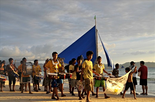 This was taken during the fiesta in Boracay. I had just come back from spending the day aboard a yacht with my office mates. When I was walking back home, I saw these boys with the drummers right behind them.