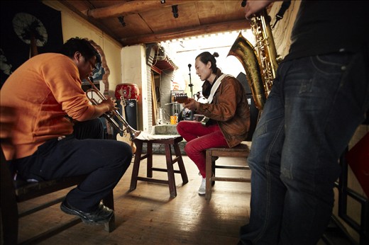Evolving music: Fusing Mandarin lyrics with the musical sounds of the West, a Chinese rock band rehearses in one of Beijing's historic hutong houses. Facilitated by increasing access to the internet and international travel, China's middle class has unprecedented exposure to a world of cultural influences. This is creating new and unique forms of cultural output that join elements of East and West.
