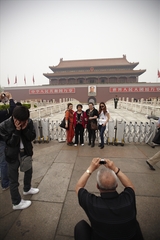 Travel boom: Chinese tourists pose in front of the Forbidden Palace, Beijing. With the easing of government restrictions on movement, China's burgeoning middle class is driving a domestic tourism boom. China already has the world's largest domestic tourism market, with close to three billion individual visits per year. The number of Chinese tourists visiting overseas destinations is expected to increase exponentially in coming years.