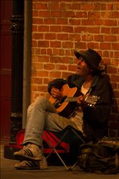 4 - A city where music has soul - the music is being played at every corner. I passed twice next to this mister before I took the photo. There were not many people waking through this street, yet he kept playing as if he was in the biggest concert on the world. This fact pushed me towards taking the photo of him and I didn't make a mistake, I can almost here his mellow voice coming out of the picture. : by midalzgb, Views[332]