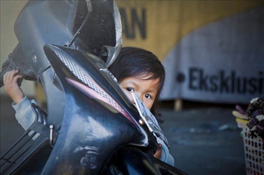 Shy child taken while chatting to her family