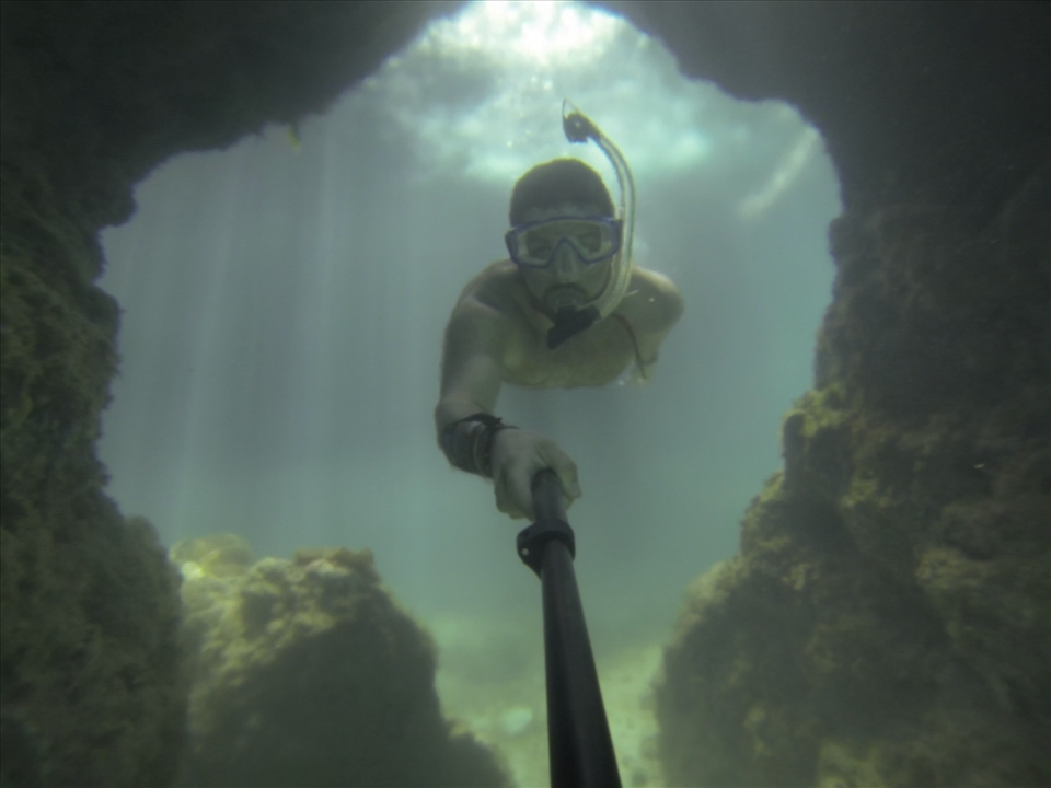 Swimming through a grotto: Xel Ha park