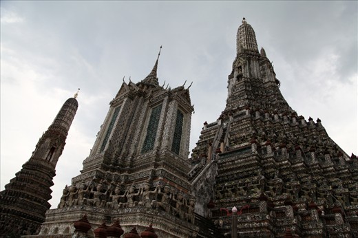 Temples of a place called Wat Arun in cloudy weather.