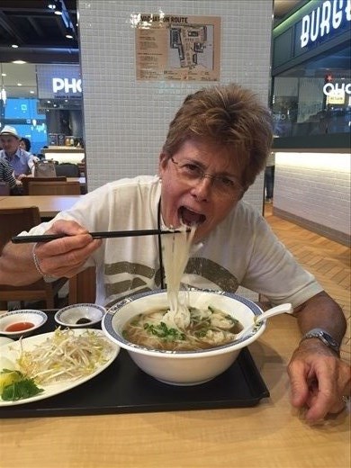 Susan eating rice noodles
