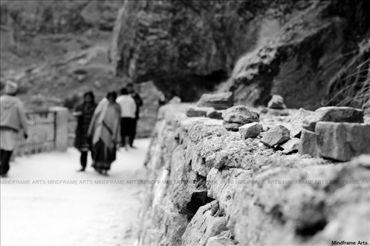 OLd World Charm. Kids in Mana Play with stones, making buildings of them.