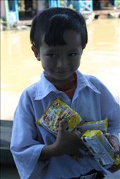 A boy at the primary school happily receiving some noodles.: by minhtue, Views[285]