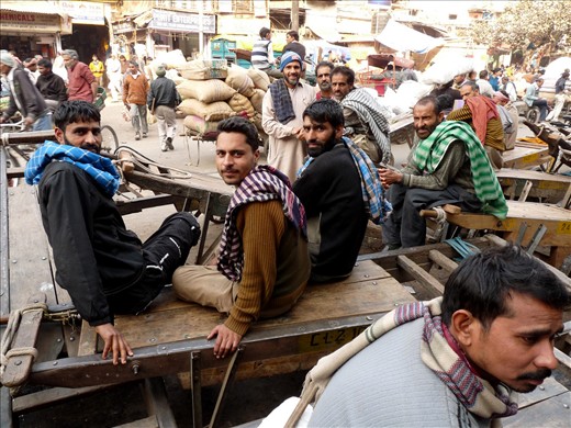 Smiles and hope - A group of Kashmiri migrant workers smiles at the camera. The ongoing militancy and daily clashes in Kashmir have made lives of local people very tough and cut the employment to nil. So, Kashmiris now have to migrate to other parts of India in search of odd jobs. Some bring with them woollen items and dry fruits and sell them in small towns and others, who don't have anything to offer, just resort to plain hard labour. With the hope that one day their homeland shall be peaceful and they shall return...