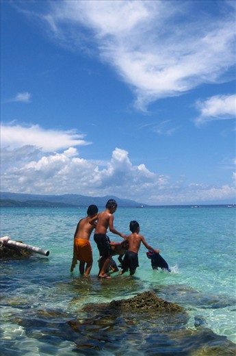 The other locals.

Moalboal is a sleepy town. One or two locals would be at each guesthouse or restaurant, chatting with each other, some of the men out on their boats, a handful of foreigners, mainly solo travellers, diving or sitting at a bar. Then there were the children. So carefree, playing with their mates with wide smiles, radiating pure joy.