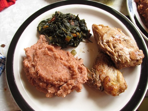 Sorghum meal with bean leaf stew and fried chicken