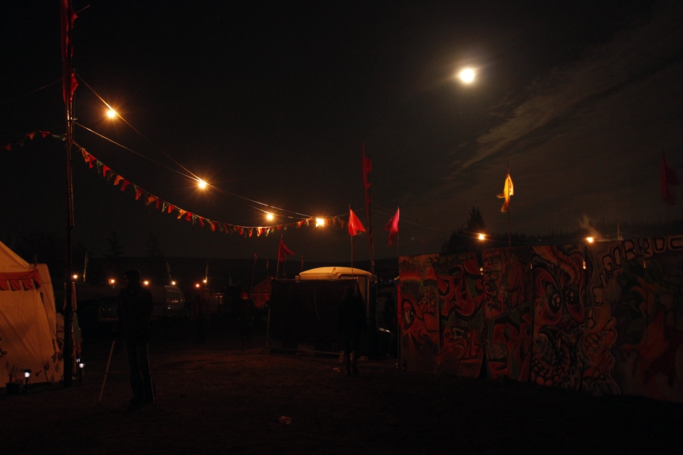 A man attends the festival despite his broken leg (left bottom side).