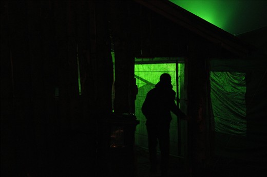 A green light shines from back stage.