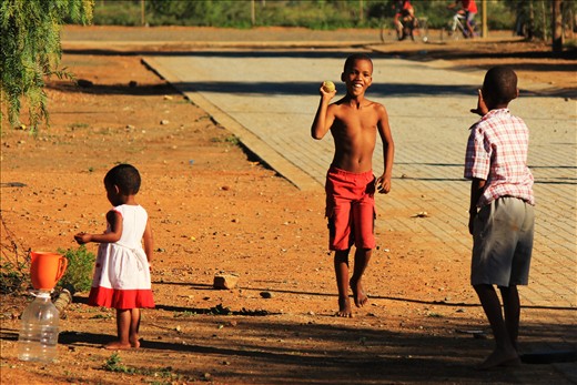 Pearston may be poor town, but their children giggle on, inviting all to play. Prevailing humanity, and far better than me at cricket.