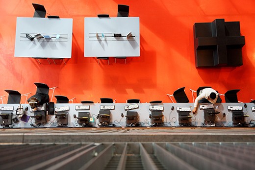 There are two people using the computer on the first floor of the library. (Seattle Public Library)