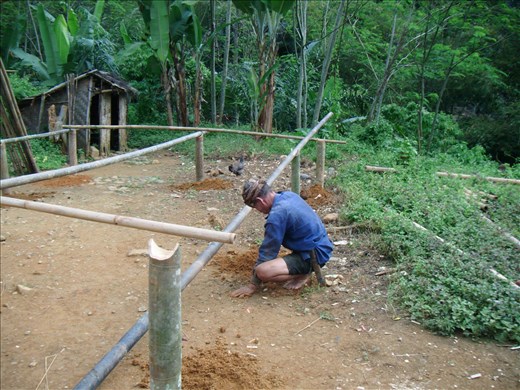 A man of Badui Luar Tribe develops his new house using bamboos.