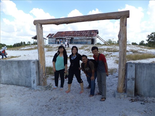 Had a pose in front of the Rainbow Troops' 'shack school'.  