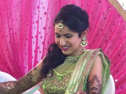 Nital (the bride). She is getting the mendhi finished on her foot.  She looks like royalty!!