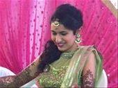 Nital (the bride). She is getting the mendhi finished on her foot.  She looks like royalty!!: by mlodius, Views[507]