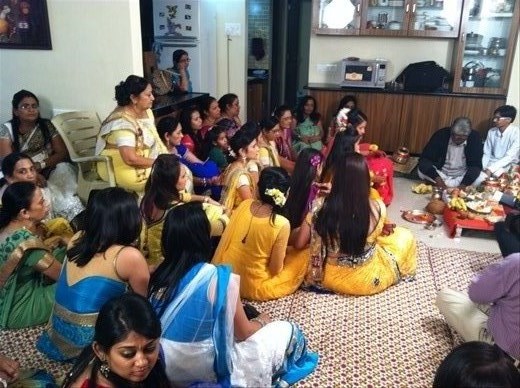 2nd day. Gathered around for the rituals involving turmeric, grain, and coconuts. The women of the immediate family are all in yellow. 