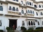 Our beautiful lakeside heritage hotel in Udaipur. Anna is standing in the entrance -- our room is the mirror image of the one to the immediate right on the ground floor ( it would be on the left). Lovely cushioned window seat for lounging and looking out at the garden and lake. : by mlodius, Views[206]