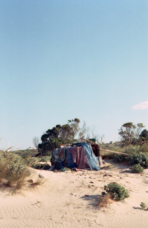 homeless shelter on the beach. between the sea and the city