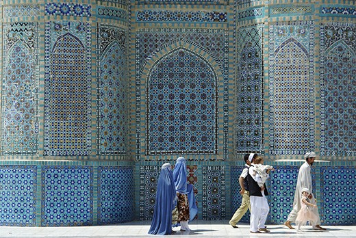 An entire Muslim family attending the weekly Friday prayers at the Blue Mosque in Mazar-e Sharif. 
Although Taliban laws dictating that women must mandatorily wear the characteristic chadri in public are no longer enforced, women still continue to wear it. Similarly, women can easily be spotten walking behind the husband, just like it was required by the Taliban - back then with a strict rule of no less than 5 meter behind the man. 