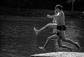 Early autumn: Two boys enjoyng the last days during which the lake's water is not freezing cold , jumping almost  synchronously in the water.: by mogosa, Views[321]