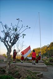 Children flying the Indonesia flag every morning. Elementary school located in the village Belandingan Belandingan, Kintamani, Batur District, Bali, Indonesia. Children - children come to school from 06.30am, upon arriving at school they share picket duty. Some school children were always clean the soiled with dust sand, some waving flags and others watering the plants. Children - children are always excited when flying the flag of Indonesia, for those flying the flag of an expression of their love for the country.: by mohammadrezagemiomandi, Views[2499]