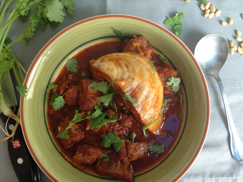 Pork ribs stew in tomato sauce with cabbage
