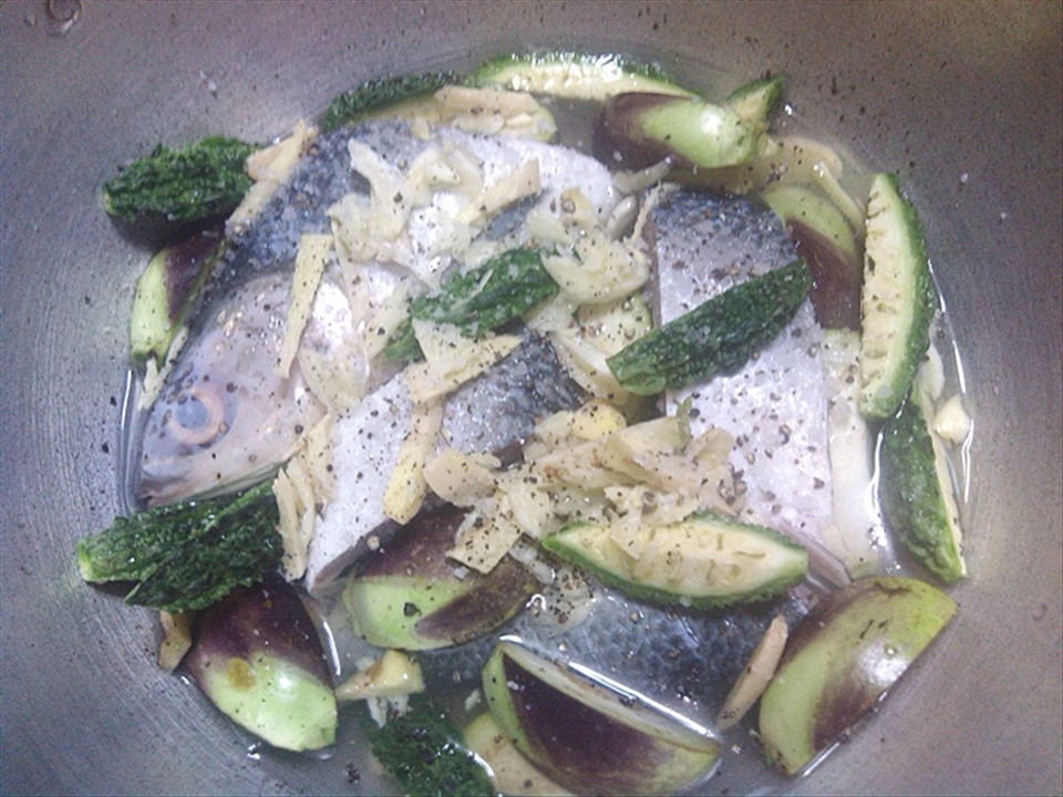 The layering of ingredients prior to application of heat.