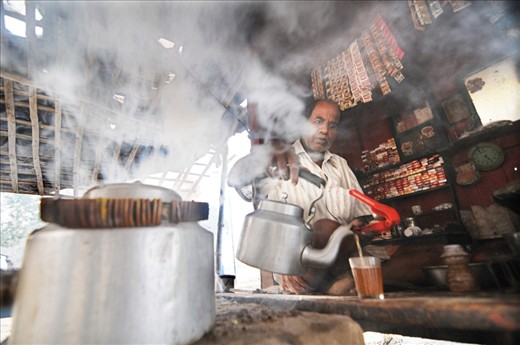 A tea vendor prepares lemon tea on coal fire in a locality of Varanasi. Though very uncommon at tea stalls in Varanasi, this lemon tea contains special herbs which has been proved good for health. 