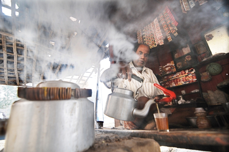 A tea vendor prepares lemon tea on coal fire in a locality of Varanasi. Though very uncommon at tea stalls in Varanasi, this lemon tea contains special herbs which has been proved good for health. 