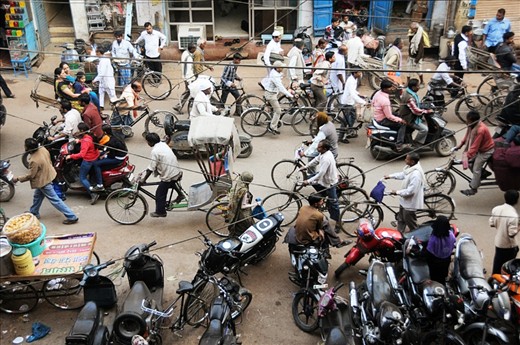A busy street in Varanasi during peak hours of travel. Locals generally prefer to travel on bicycles and motorcycles to commute, rather than using bigger vehicles due to narrow lanes and heavy traffic.