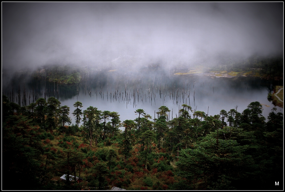 Shangarila lake-clouds keeps crossing over this lake with misty feel