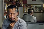 Local tattoo artist sits in his shop waiting for his next cilent. : by moniquemontfroy, Views[546]