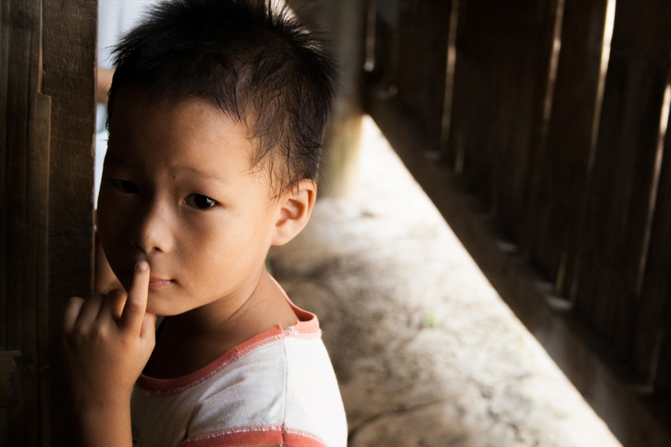 I'm probably one of the first foreigners that this young Burmese refugee has seen in his life.
