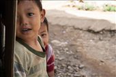 Hide and Seek with a camera.
Whenever these two young refugees saw the camera they sprinted away at top speed, but inevitably sneaked back to view every photograph.: by moonlight, Views[920]