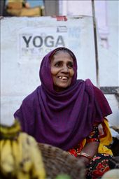 A vibrant market women sits at her market stall.: by moosey84, Views[272]