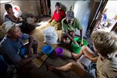 Fisheries researcher tallying market haul of local fishermen in their hut: by morgantrimble, Views[241]