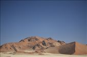 Sand Rising - Located in the world oldest desert, the sand dunes and mountains of the Namib-Naukluft National Park make up the 4th largest game park in the world covering an area of almost 50,000km2. A unique landscape with unique ecology and average annual rainfall of only 100mm per annum. Sand dunes rise to heights of greater than 300m, creating a imposing barrier to the cold southern atlantic winds which bring vital moisture to the landscape. Namib-Nauklft National Park, Namibia.: by morgs_c, Views[511]