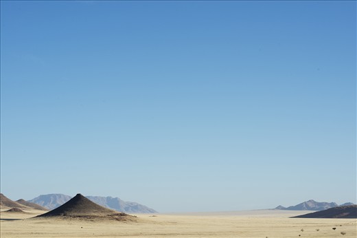 The Namibian Pyramid - 
A true sucess story in Namibian conservation efforts. Founded in 1992, the NamibRand Nature reserve covers over 2000km2 of former farm lands and shares a 100km border with the Namib-Naulkaft National Park. Financed by low impact eco tourism, the private game reserve has been restored with the removal of over 1500km of fencing, allowing native populations of fauna and flora to retake the landscape. Namibrand Nature Reserve, Namibia.