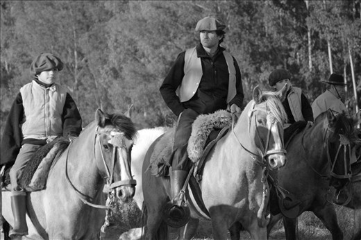 People of different ages celebrate the day of their local hero on a horse exodus. It takes two days with some stops.