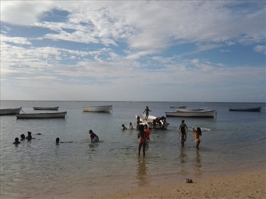 Children playing and having fun at the beach in Mauritius