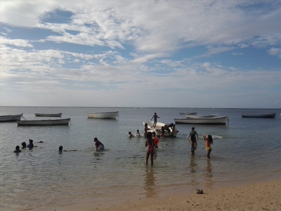 Children playing and having fun at the beach in Mauritius