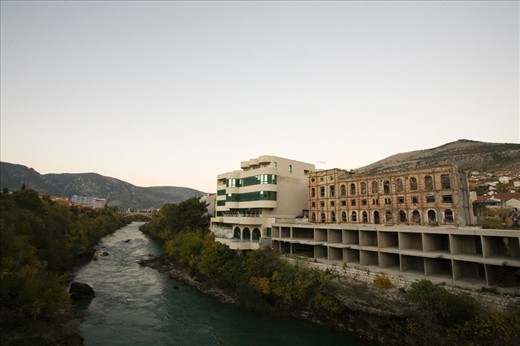 The Croat–Bosniak War took place in the city of Mostar between 1992-1995.
The juxtaposition of the newly built and left destroyed buildings can be seen all over the city of Mostar. 

