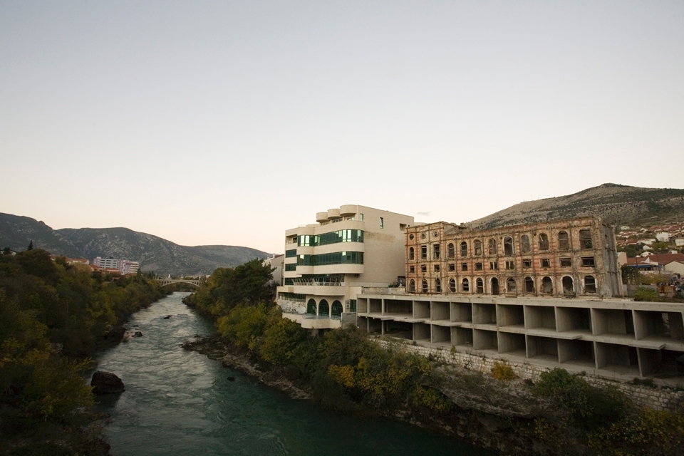 The Croat–Bosniak War took place in the city of Mostar between 1992-1995.
The juxtaposition of the newly built and left destroyed buildings can be seen all over the city of Mostar. 
