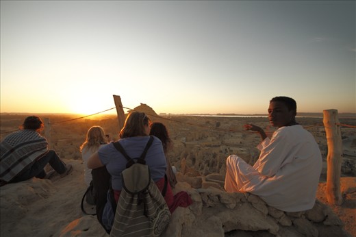 SHALI Sunset, as most of the touristic Places in Egypt, many Siwaian people work as touristic guide, even this small boy who guided this group up to SHALI “old town in Siwa, and topmost place as well” just to witness the sunset of Amun-Ra (Sun god in Pharaonic culture)