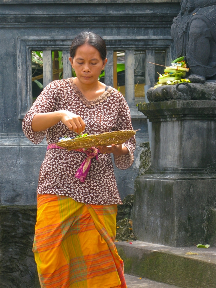 The Mother of the small boy was not too far away leaving her offerings for a successful and plentiful day at their family shrine. It was mid-morning and the tourists were now arriving by the busload. Not too long after this shot was taken there was much coaxing by mother to her young son to smile at the tourists and get on with his job of selling his wares. It’s a hard life in these small communities everyone has to work