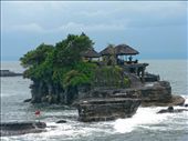 Tanah Lot the temple in the sea is one of those classic post card shots that many take at sunset on a visit to Bali. Unfortunately the weather was not on my side and had been raining for days so I just had to take the opportunity that I was given and that was a nasty grey old day.  It was quite a busy day, there were many tour buses there and the place was crawling with people. The temple is located in the ocean and can only be accessed at low tide. Unfortunately it was high tide so we couldn’t get up close and personal but we were told we wouldn’t be allowed to enter anyway which I think is fair enough. We took heaps of pictures waiting our turn with the many people in the prime photographic points all taking turns. Everyone was very friendly and respectful to one and other no pushing and shoving for prime spots. Getting a picture without any other tourist in view was tricky.: by mrsgee, Views[674]
